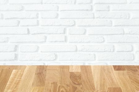 light brown wooden planks as a wood table or parquet floor in perspective, isolated on white brick wallの写真素材