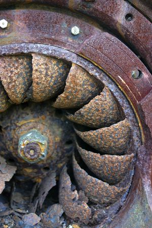 Detail of an old and rusty turbine to generate electricityの写真素材