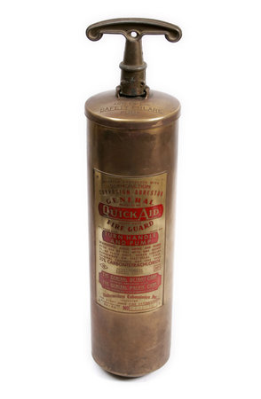 Old easily portable extinguisher of brass