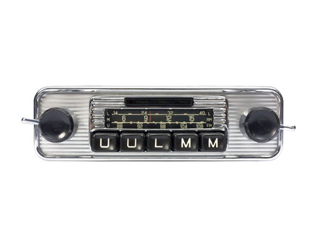 Old auto radio isolated on white. Front view.