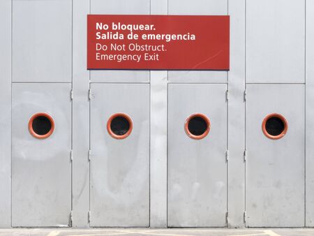 Emergency doors outside of a larger building in trade fair.の写真素材