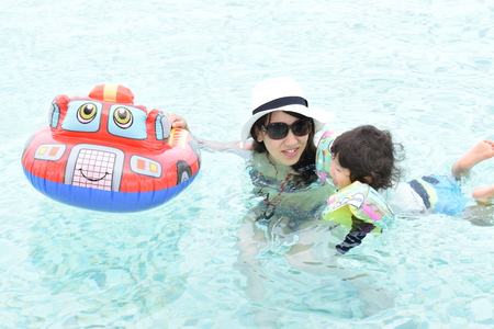 playing mother and baby at pool 3の写真素材
