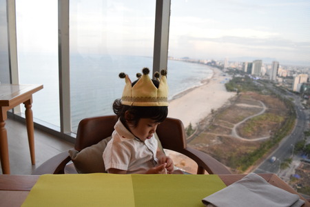 cute baby is in door with crownの写真素材