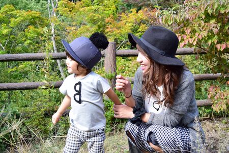 young japanese mother is playing with her sonの写真素材