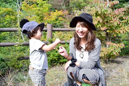 young japanese mother is playing with her sonの写真素材