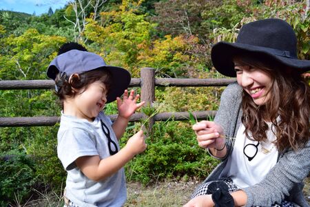 young japanese mother is playing with her sonの写真素材