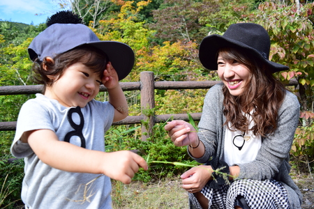 young japanese mother is playing with her sonの写真素材