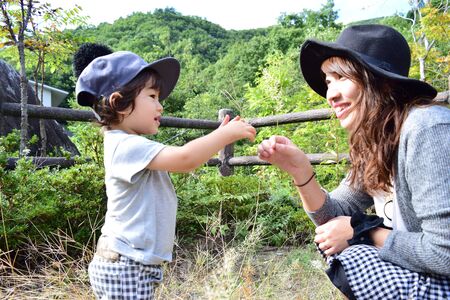 young japanese mother is playing with her sonの写真素材