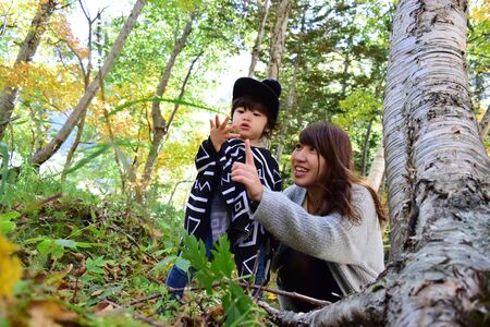 young japanese mother is playing with her sonの写真素材