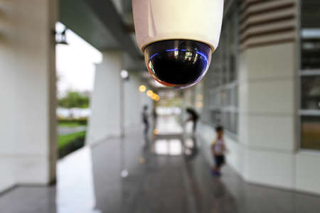 Outdoor CCTV monitoring, security cameras at a walkwayの写真素材