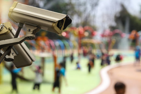 CCTV monitoring against blur kids enjoying their time at kid Water Park.