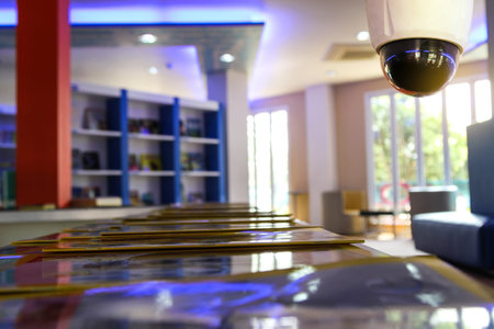 Interior of a modern hotel lobby with a security camera, blurred background