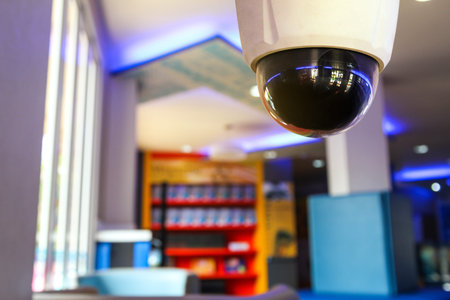CCTV security camera or surveillance system in modern office or hotel.