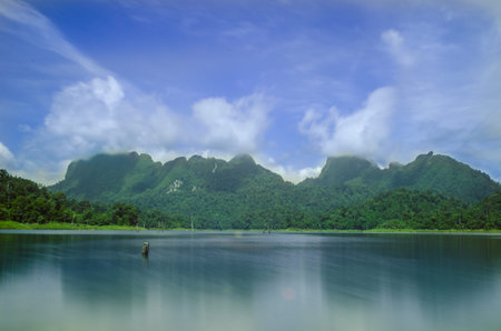 Nice scene of bay see smooth water and foggy on mountain