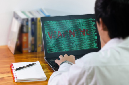 Programmer coding in the computer.