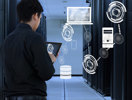 Business man working in data center with cloud technology Business man working in data center with cloud technology