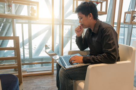Man use laptop in airport loungeの写真素材