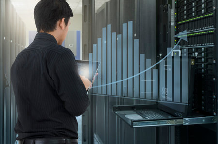 Man working in data center and use tablet for analyze system