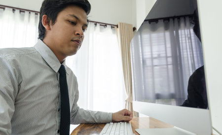 Business man working with computer in home office
