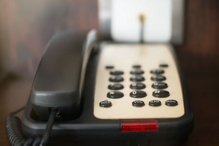 Telephone hotel on deskの写真素材
