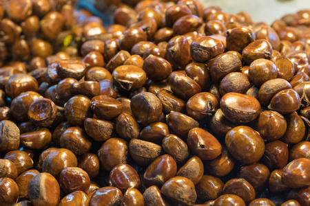 Closeup roast chestnut stacking in the marketの写真素材