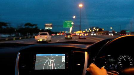 Driving a modern car on the road.の写真素材