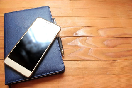 Phone book on wood background.の写真素材