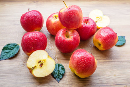 Fresh Red apples on brown wooden backgroundの写真素材