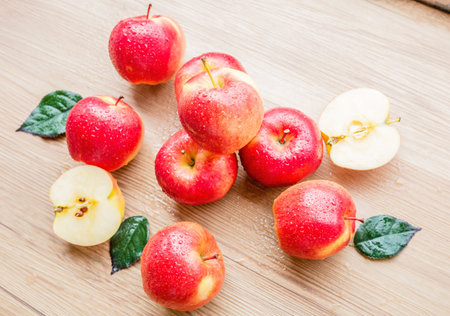 Fresh Red apples on brown wooden backgroundの写真素材
