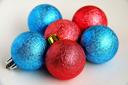 Six red and blue christmas blubs on white backgroundの写真素材