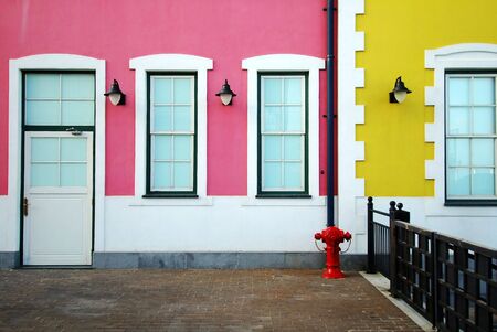 Beautiful colored houses, pink and yellow colorの写真素材