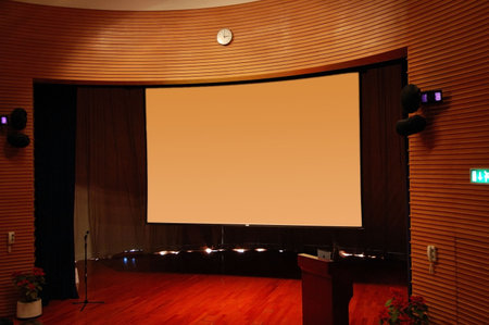 The interior of a theater, the stage and screen