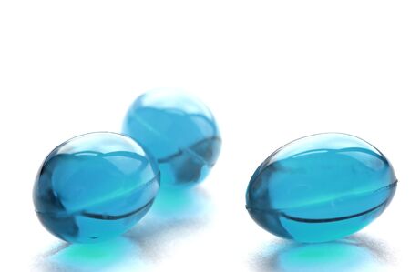 An abstract picture of vitamins pills in cyan colorの写真素材