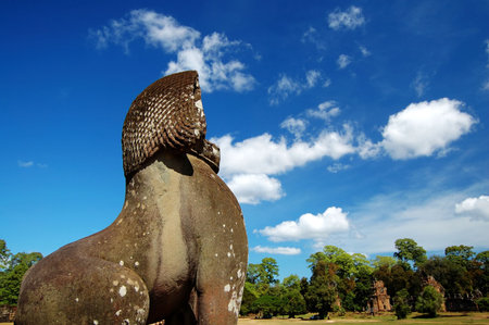 A lion guard facing the Prasat Suor Pratsの写真素材