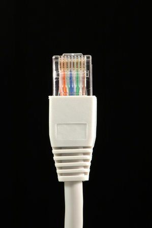 Close up of patch cable over black