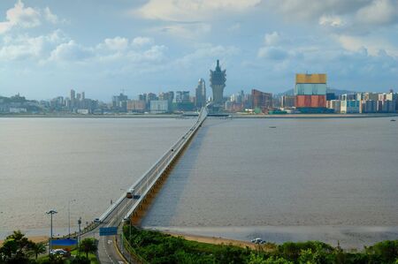 A view of Macau city with Macau-Taipa brigde with connection between the Macau peninsula and Taipa islandの写真素材