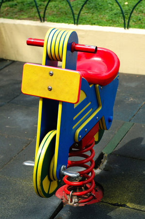 A colorful toy bicycle at the citypark playgroundの写真素材