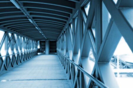 The perspective of transition over road in blue tuneの写真素材