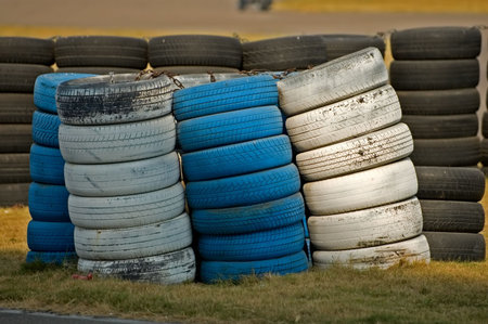 The worn tires stacked on road side