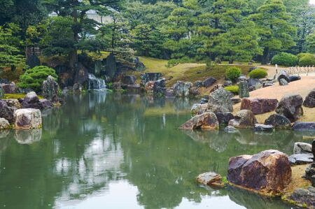 Beautiful Japanese garden with trees and pondの写真素材