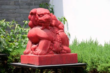 A stone lion of Chinese temple, in gardenの写真素材