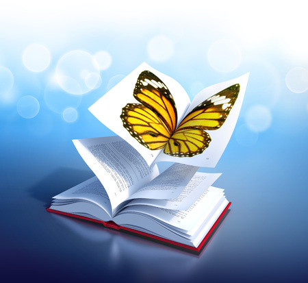Red hardcover book open in its middle, as the wings of a butterflyの写真素材