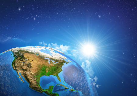 Rising sun over the Earth and its landforms, view of the United States of America. Elements of this image furnished byの写真素材