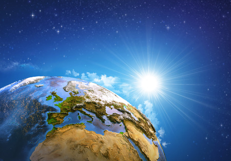 Rising sun over the Earth and its landforms, view of Europe, North Africa and Middle East. Elements of this image furnishedの写真素材
