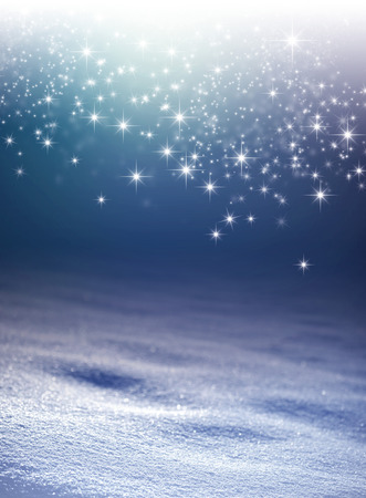 Snow background at night with star lights raining downの写真素材