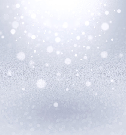 Silver background with blurred lights falling downの写真素材