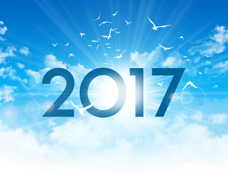 New Year 2017 type high in blue sky with the sunrise and birds flightの写真素材