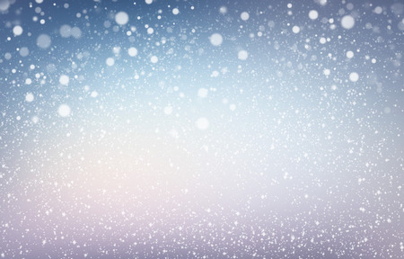White snow shapes and soft lights on a blue iced backgroundの写真素材