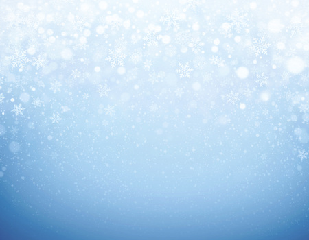 Snowflakes shapes and snowfall on a frozen blue background - Winter materialの写真素材