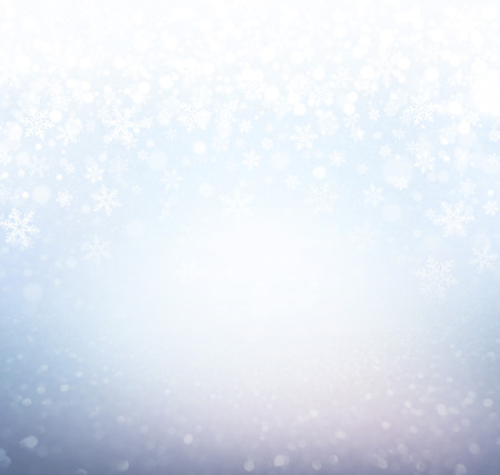 Snowflakes and snowfall on a icy blue background - Winter materialの写真素材